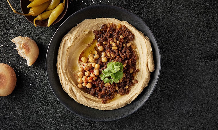 Vegan Hummus with meat dish